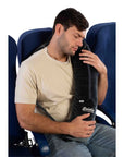 Business traveler using Bolstie travel pillow to support head and chest on long flight